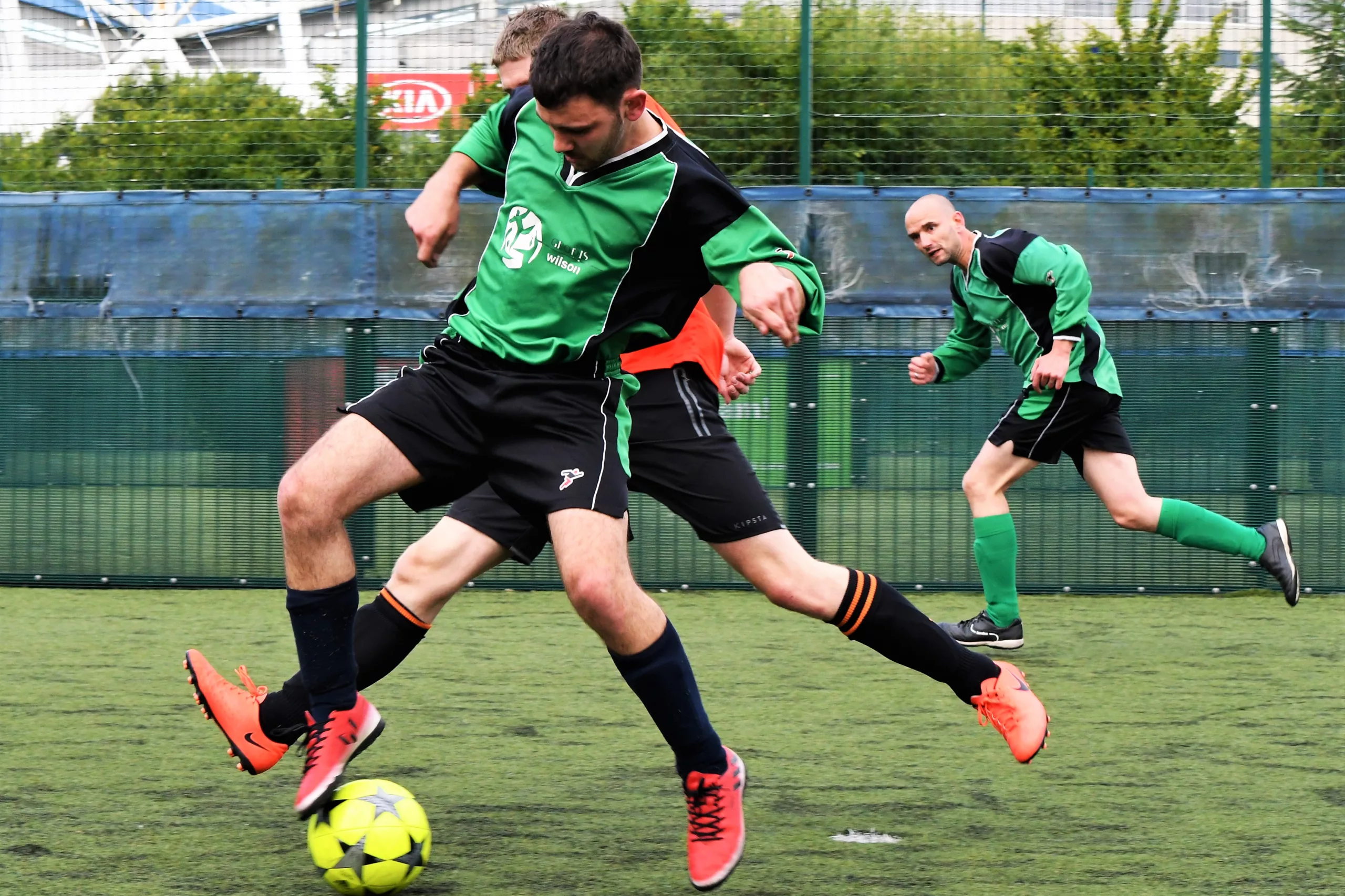 men playing football on bolton arena football pitches