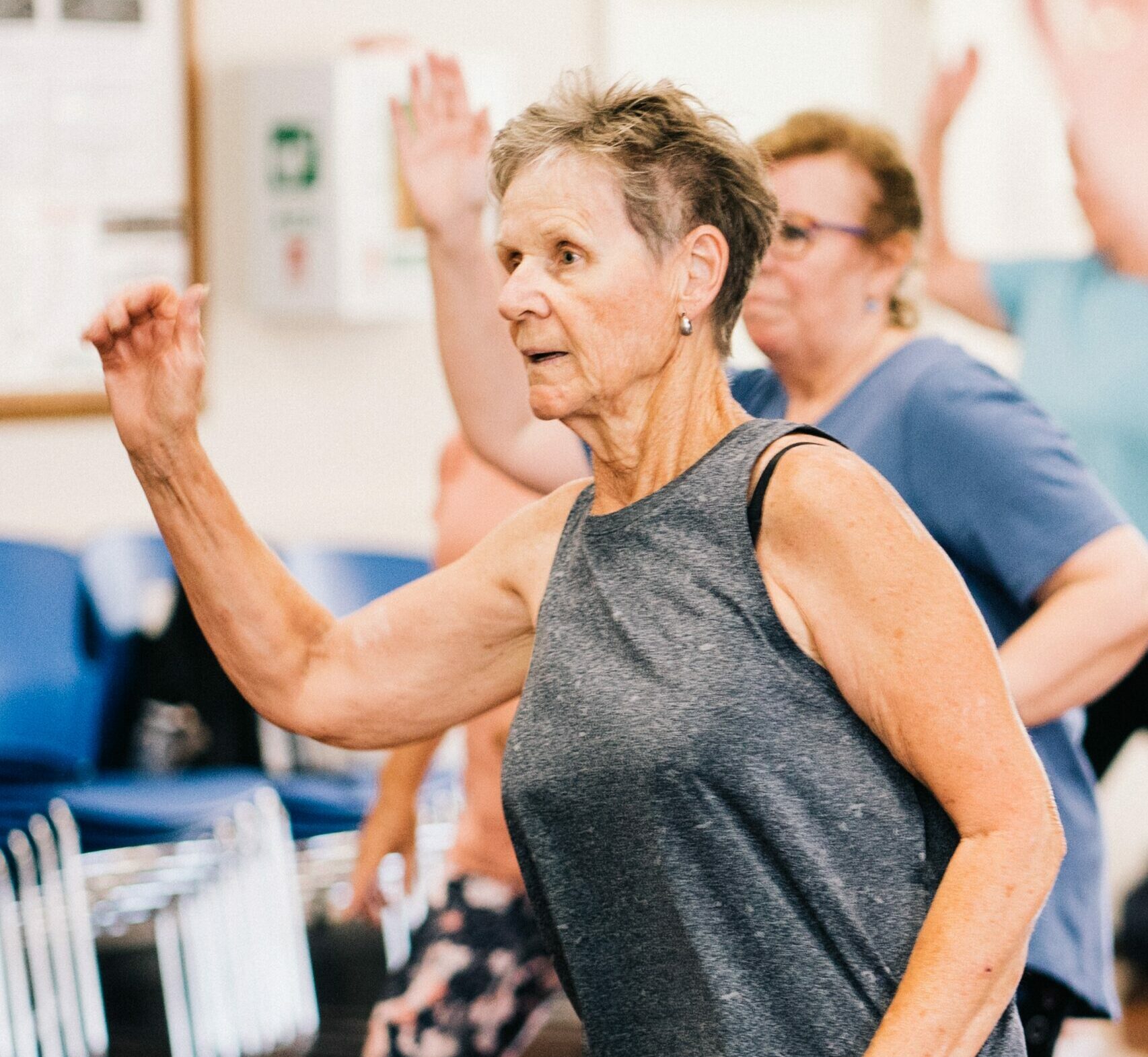 older woman doing an exercise class