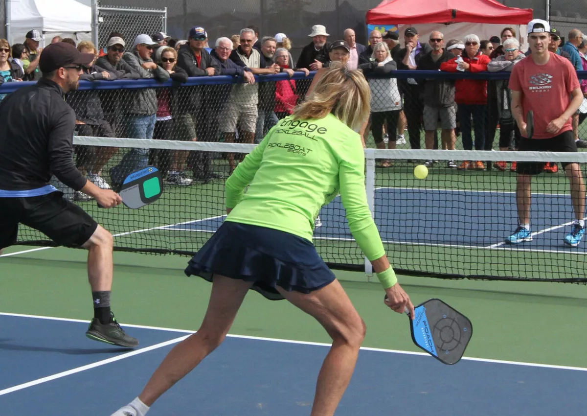 Couples playing Pickleball outdoors in nationals